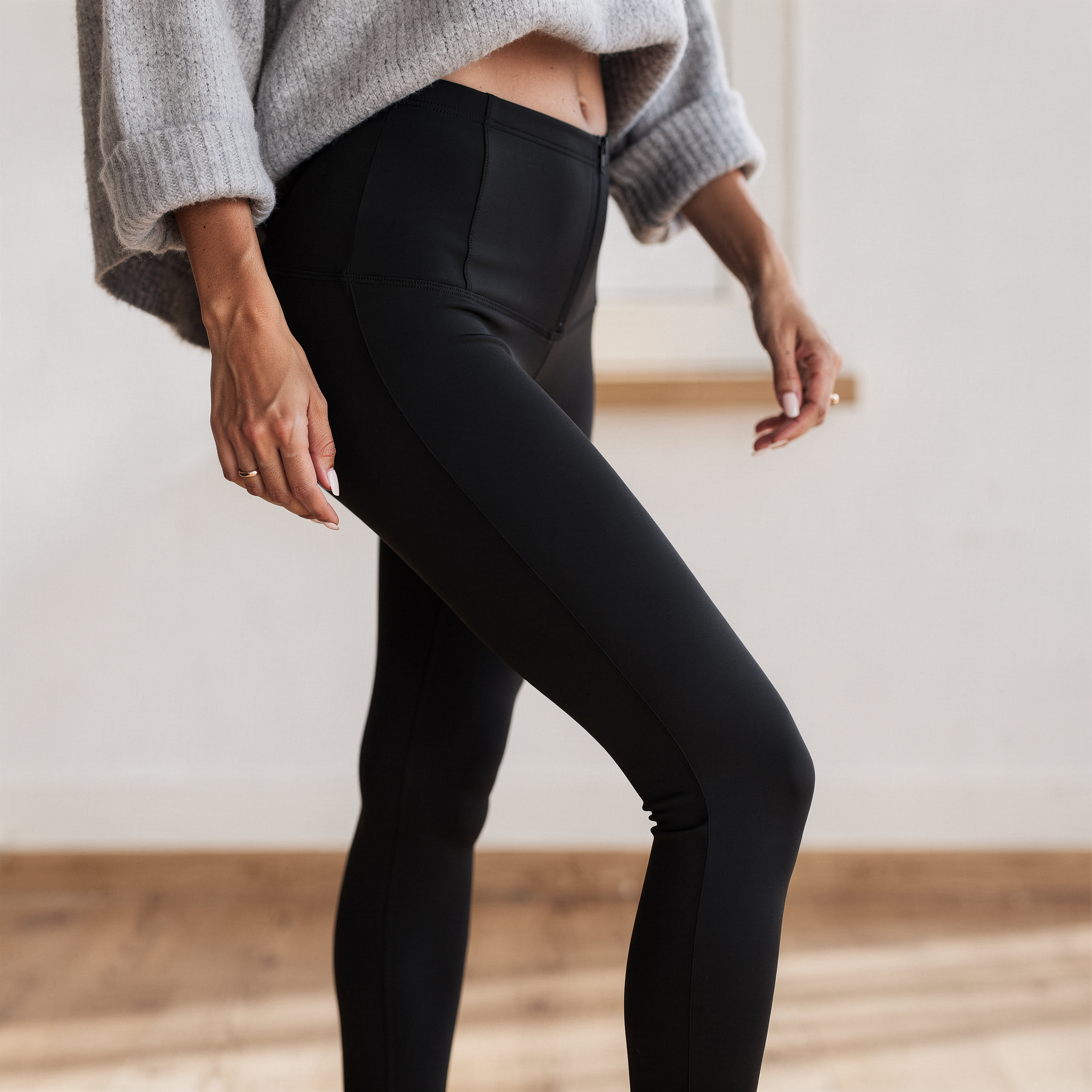 High-rise black sculpting leggings for women made from soft stretch fabric, designed for a sleek and supportive everyday fit
